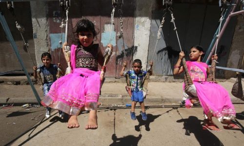 TOPSHOT - Iraqi children play on a street in the capital Baghdad on September 12, 2016, on the first day of Eid al-Adha holiday.
Muslims across the world celebrate the annual festival of Eid al-Adha, or the festival of sacrifice, which marks the end of the Hajj pilgrimage to Mecca and commemorates prophet Abraham's readiness to sacrifice his son to show obedience to God. / AFP PHOTO / Ahmad al-Rubaye